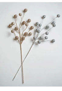 Macro view of champagne gold and silver glitter berry stems for Christmas tree decoration