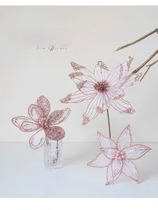 Detailed trio of pink artificial Christmas flowers with glitter sequins and mesh petals