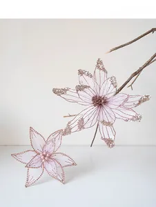 Close-up of pink mesh artificial Christmas flowers with sequins and pearl centers
