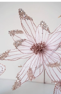 Macro shot of pink mesh Christmas flower with rose gold glitter and sequin details