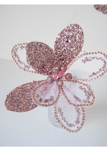 Macro detail of a luxury pink Christmas flower with sequins, beads and gems decoration