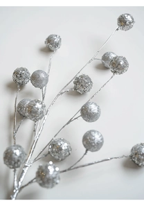 Close-up of silver glitter berry stems with sparkling sequins for Christmas decor