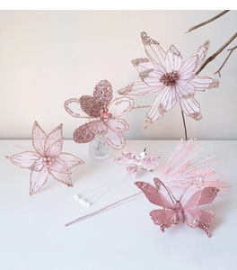 Detailed view of pink mesh Christmas flowers with rose gold glitter and pearl accents