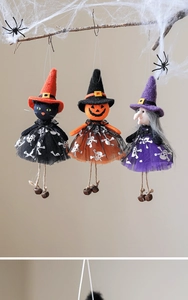 Halloween felt ornaments featuring black cat, pumpkin, and witch with bells on spider web branches