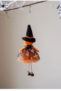 Detail of Halloween witch hanging decoration with tulle skull skirt and metal bells