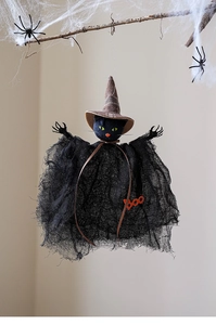 Close-up of black cat wizard hanging ornament with mesh robe and BOO decoration