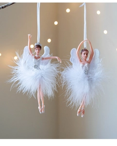 Detailed view of white ballet dancer ornaments with real feather skirts and glitter wings