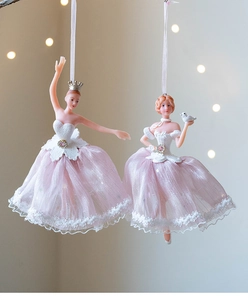 Detail of elegant ballet dancer ornaments with pink tulle skirts and lace wings