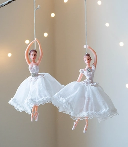 Detail of ballet dancer ornaments with layered white tulle skirts and sparkling crystals