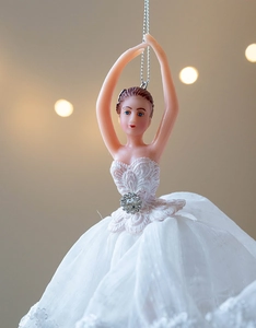 Detail of elegant ballerina ornament with white lace tutu and sparkling rhinestone accents