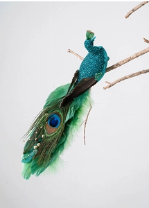 Detail of blue glitter peacock ornament with real feathers and eye-spotted plumes