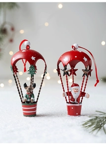 Detail of Santa and reindeer iron parachutes with red star canopies for Christmas decor
