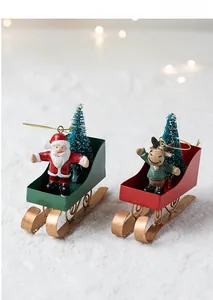 Detailed Christmas sleigh ornament set with Santa Claus, reindeer, and mini pine trees