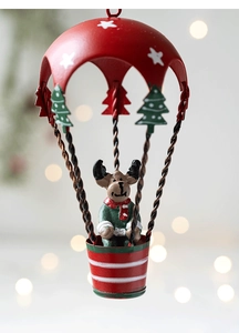 Detailed view of Christmas hot air balloon hanging ornament with reindeer in red basket