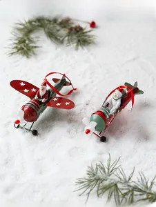 Christmas vintage metal plane ornaments with Santa and Snowman figures on snow backdrop