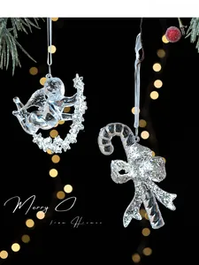 Detail of acrylic angel and silver glitter candy cane Christmas ornaments