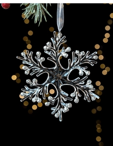 Detailed silver snowflake ornament with glitter accents and a festive ribbon hanger