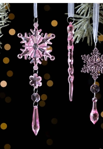 Pink crystal snowflake and icicle Christmas ornaments with silver rings on pine branch