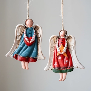 Set of two vintage resin Christmas angel ornaments with hand-painted heart and star details