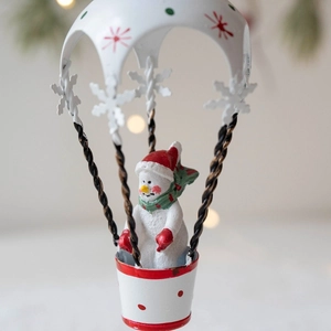 Christmas snowman hot air balloon ornament with red star patterns and white snowflakes