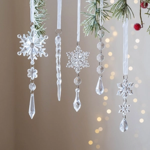 5-piece set of transparent Christmas icicle and snowflake ornaments on pine branches