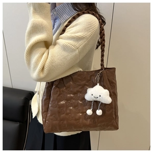 Brown quilted shoulder bag featuring bear embossing and a white cloud plush charm