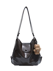 Dark brown leather shoulder bag with cloud shape design and bear charm for women