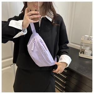 Close-up of light purple water-resistant nylon waist bag with double zipper details