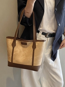 Fashionable marble pattern tote bag with brown leather trim and shoulder straps