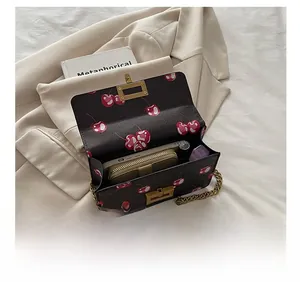 Detailed interior of cherry print crossbody bag showing large capacity for essentials