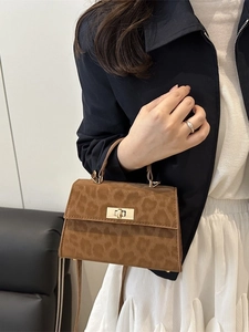 Chic leopard print trapeze handbag with gold twist lock and top handle for women