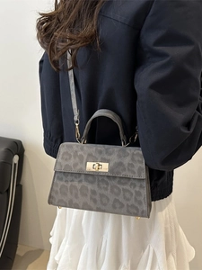 Dark grey leopard print handbag with golden twist lock and suede texture for women