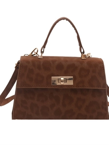 Front view of a brown leopard print trapezoid handbag with a golden twist lock closure