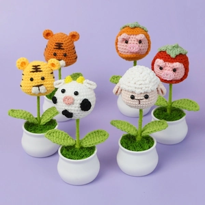 Set of six handmade crochet animal succulents including tiger cow and pig on white pots