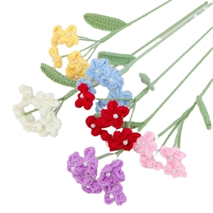 Handmade crochet forget-me-not bouquet with colorful yarn flowers and pearl centers