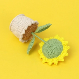 Handmade crochet sunflower potted plant with a smiling face for home decor and gifts
