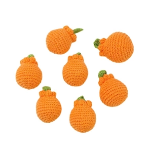 Handmade crochet orange keychain pendants with green leaf details on white background