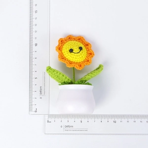 Handmade crochet sunflower potted plant with smiley face showing dimensions 11x9 cm