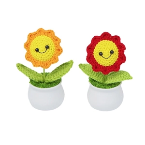Handmade crochet sunflower potted plants with smiley faces in red and orange colors