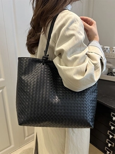 Handmade black woven leather tote bag with large capacity for commuting and daily style