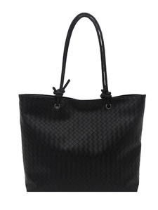 Large black hand-woven tote bag with circular rope handles for minimalist commuting