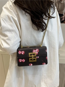 Vintage retro chain small square bag with cherry print and gold hardware shown on model