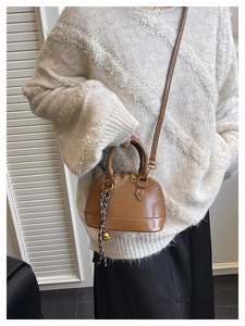 Brown mini dome bag in faux leather with gold dual zippers and woven rope charm detail
