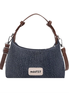 Retro dark blue denim dumpling bag with brown leather straps and adjustable buckles