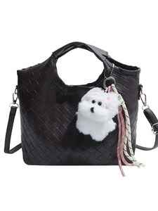 Dark brown woven handbag with crossbody strap and cute plush dog charm accessory