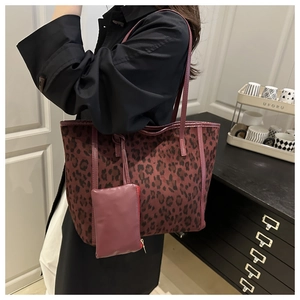 Close-up of leopard print tote bag with soft suede texture and matching mini pouch