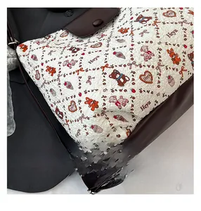 Detail of the white wrinkled fabric with cartoon animal prints and brown leather straps
