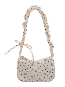 Floral corduroy dumpling bag with ruffled shoulder strap and sweet heart print