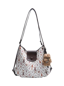 Retro white tote bag with cartoon pattern, brown leather trim and bear pendant charm