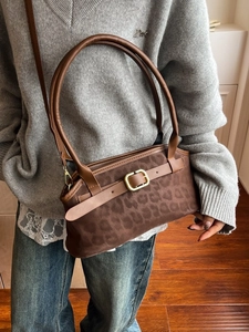 Retro brown leopard print shoulder bag with leather handles and metallic buckle detail